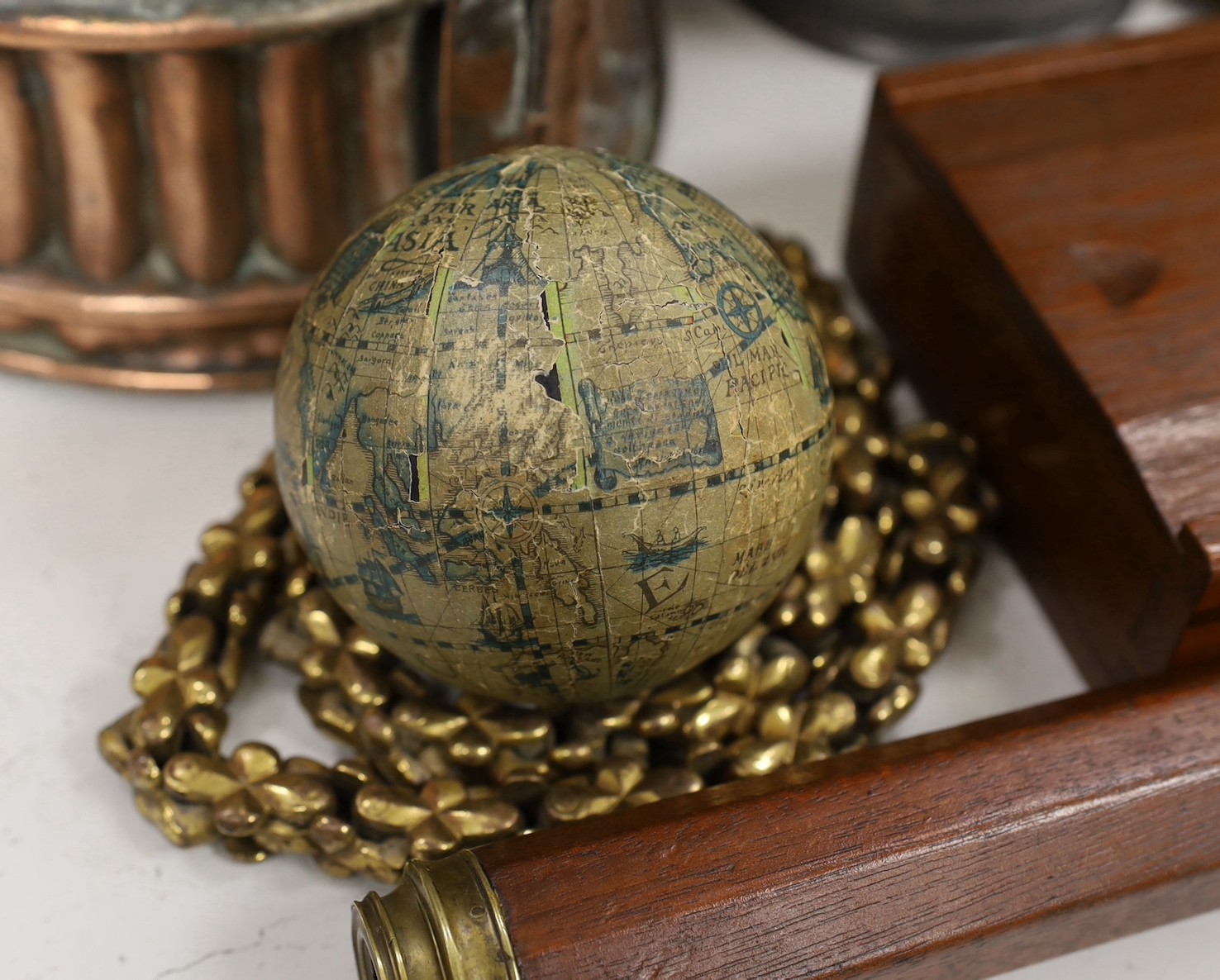 An unusual Victorian copper pie-mould, teak cased set of Bezique scorers, a brass link chain, a 19th century pewter pitcher, an Art Nouveau oil lamp, and two other items